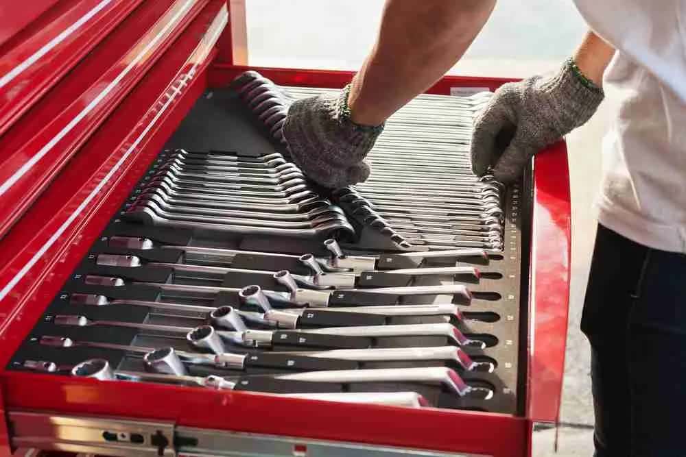 Technician selecting wrenches from a toolbox