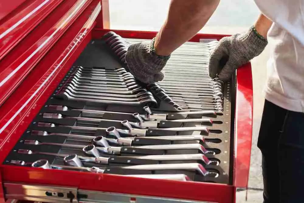 Technician selecting wrenches from a toolbox