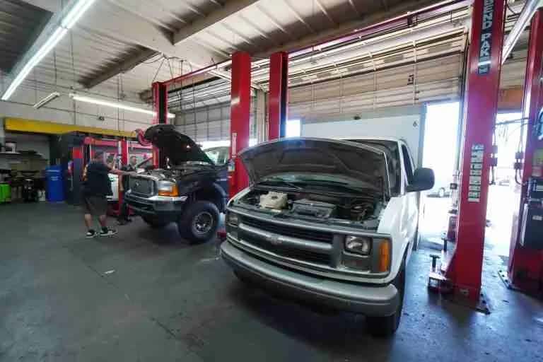 Service bays with a pickup truck on a lift