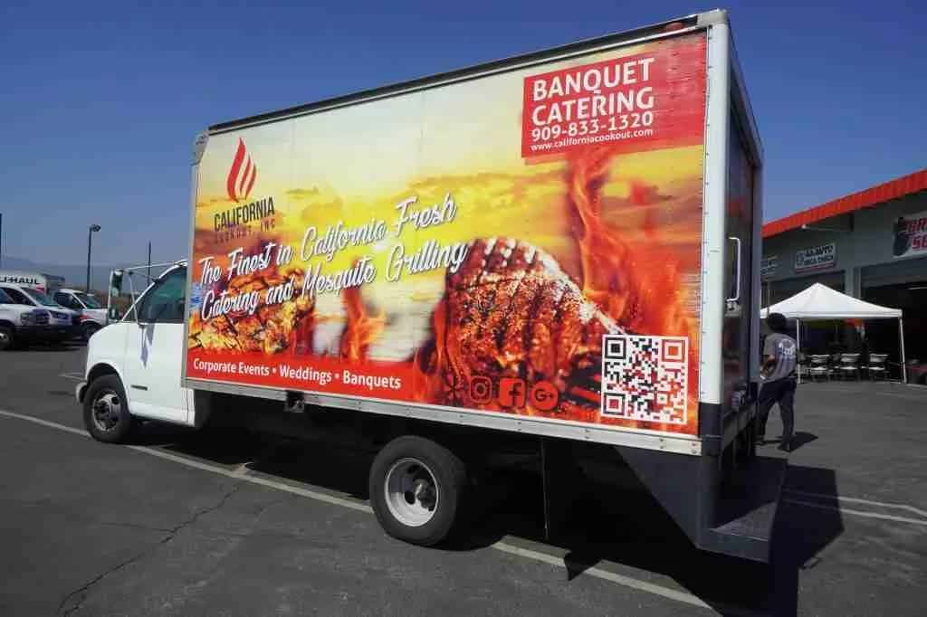 Box truck parked outside the shop