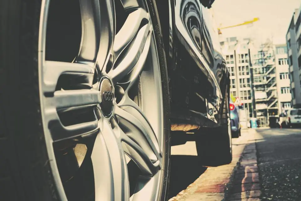 Close view of a car wheel on a city street