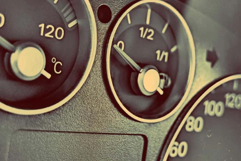 Close view of a temperature gauge and fuel gauge