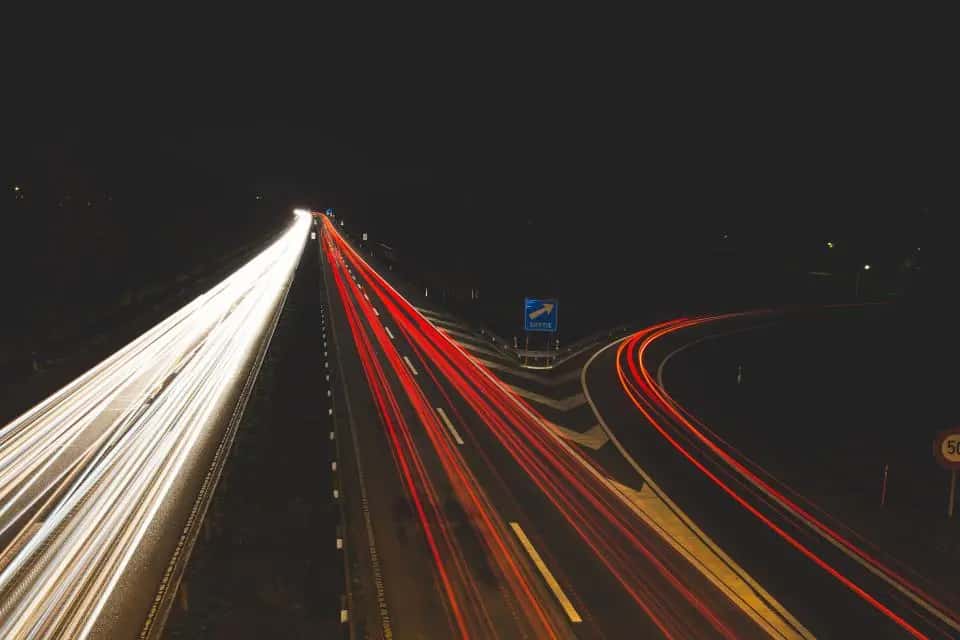 Light trails from cars on a freeway at night