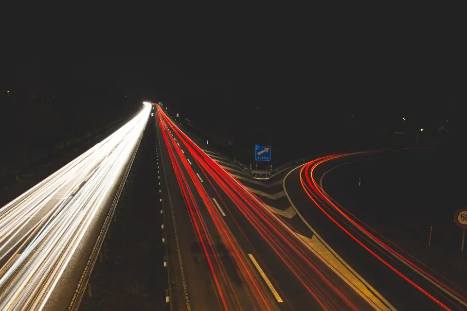 Light trails from cars on a freeway at night