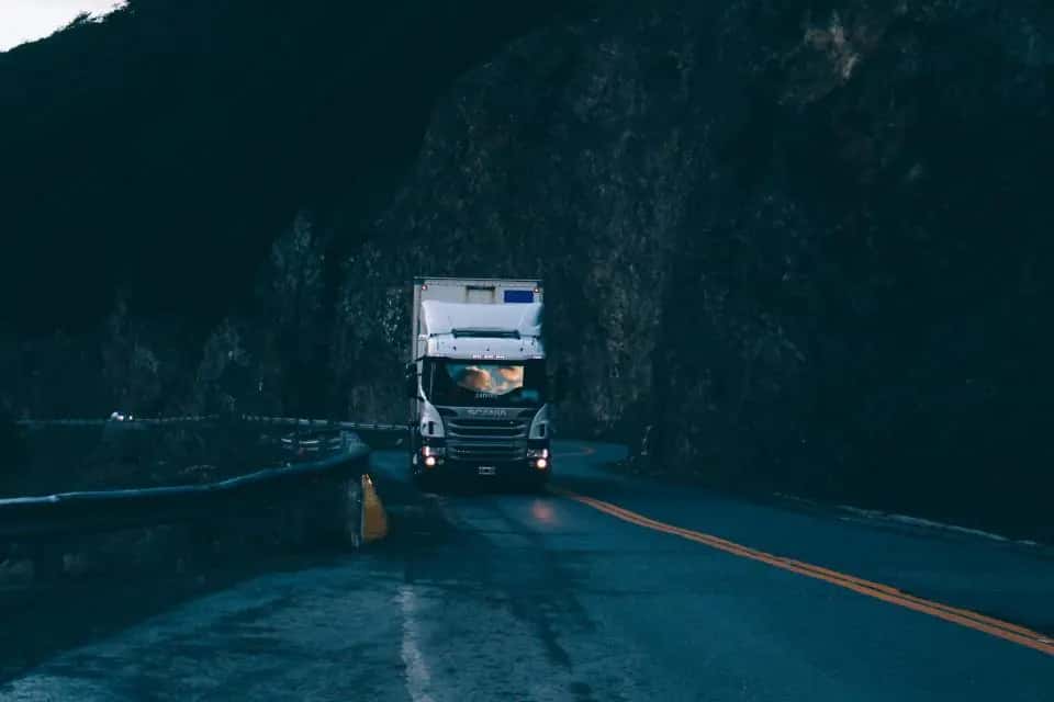 Truck driving on a dark highway