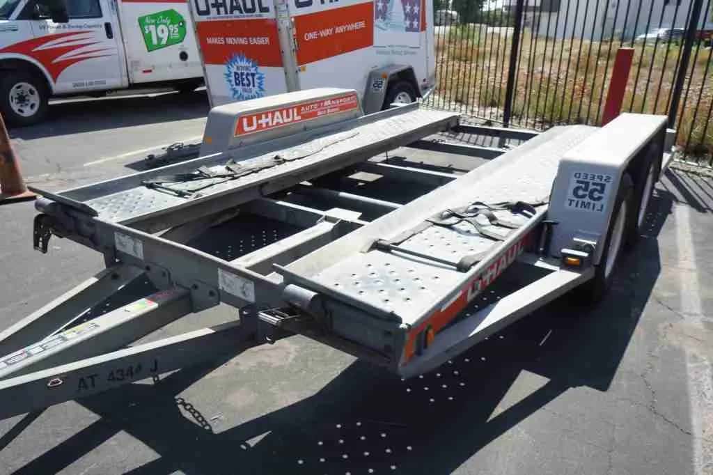 U-Haul auto transport trailer on the lot