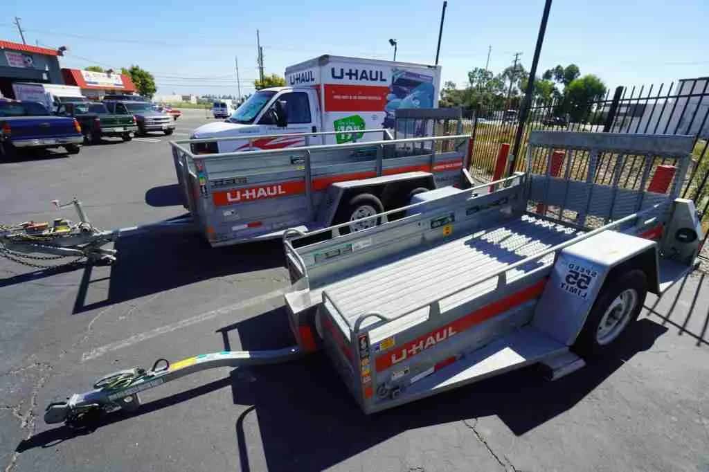 U-Haul utility trailers and trucks on the lot